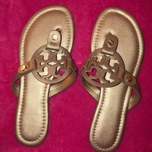 Knock-off Tory Burch gold flip flops